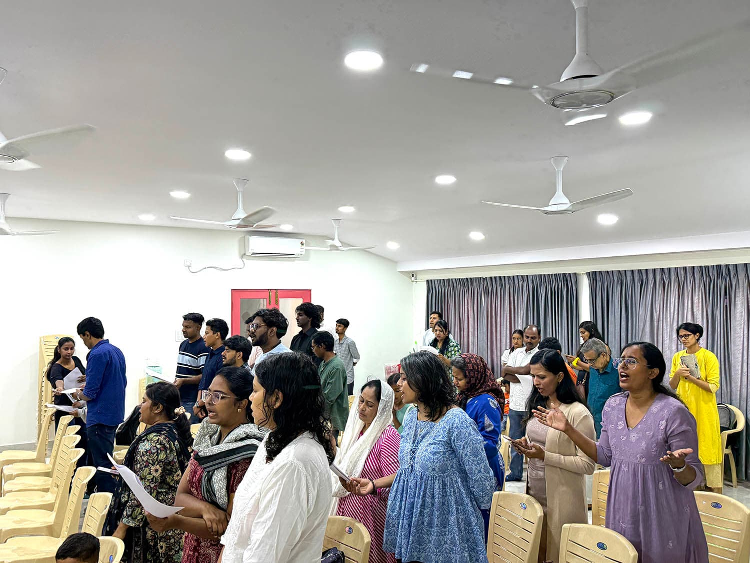 The congregation of New Life Fellowship Church, HSR Layout, singing during a Sunday service